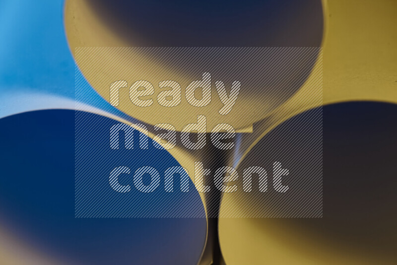 The image shows an abstract paper art with circular shapes in varying shades of blue and warm tones