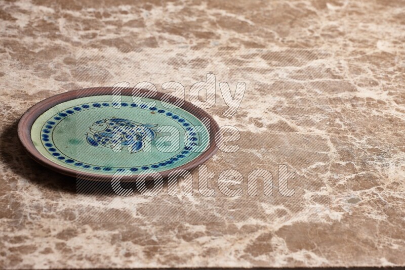 Decorative Pottery Plate on Beige Marble Flooring