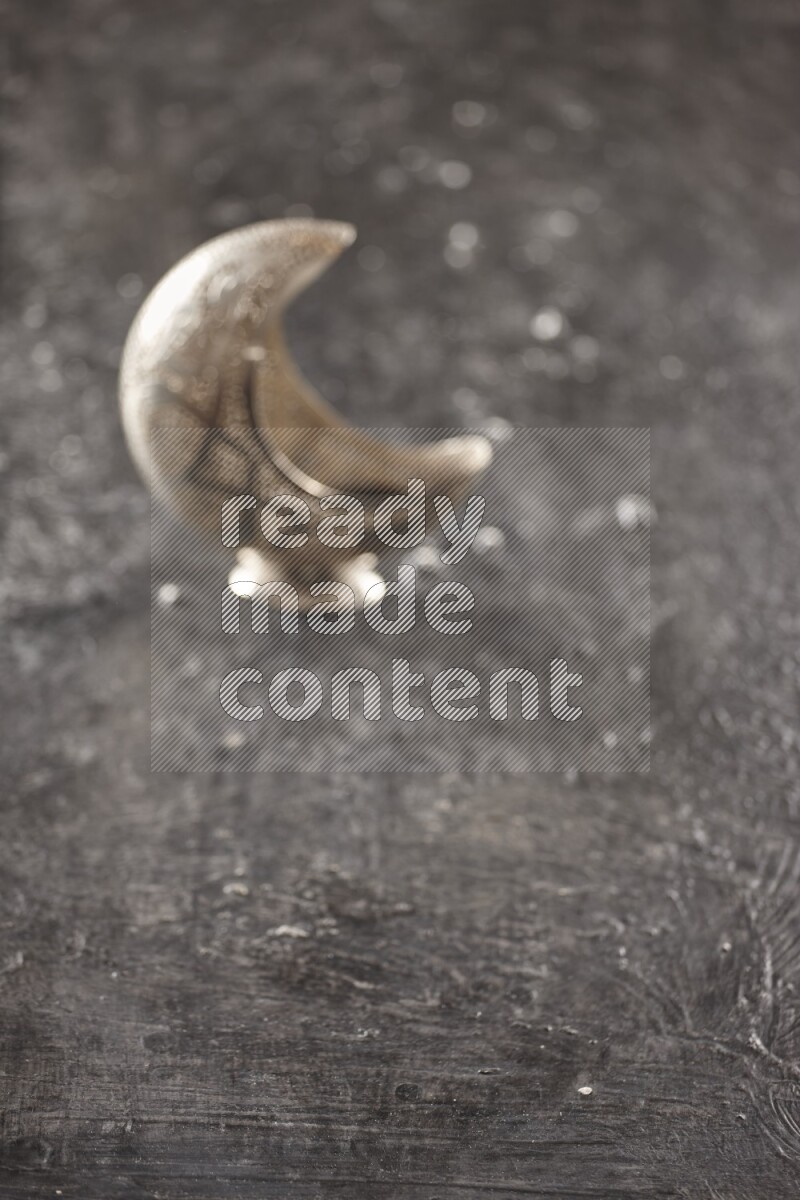 An out of focus lantern on textured black background