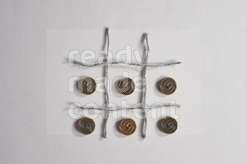 Metal buttons placed on grey background