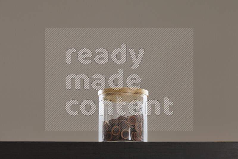 Buttons in a glass jar on black background