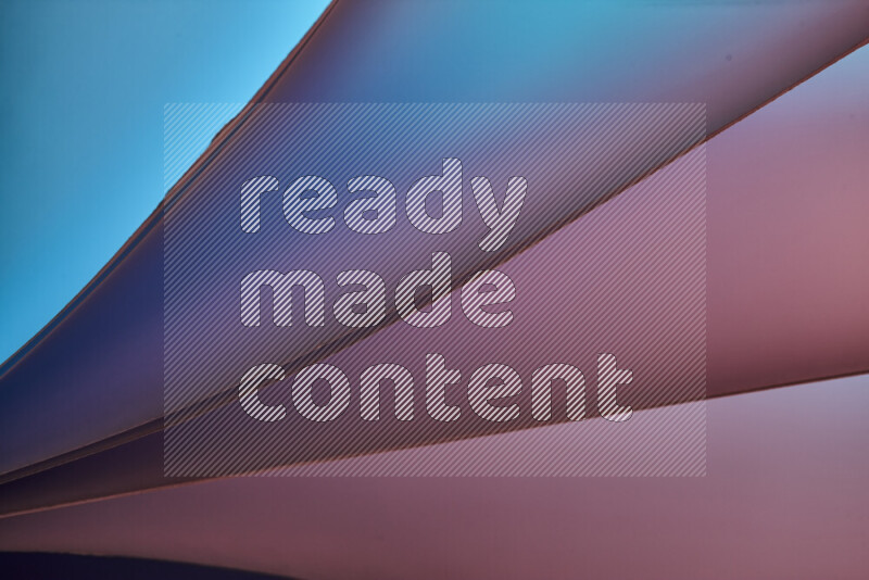 An abstract art piece displaying smooth curves in warm and cold gradients created by colored light