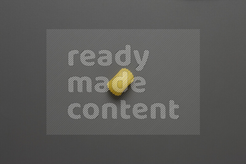 Elbow pasta on grey background