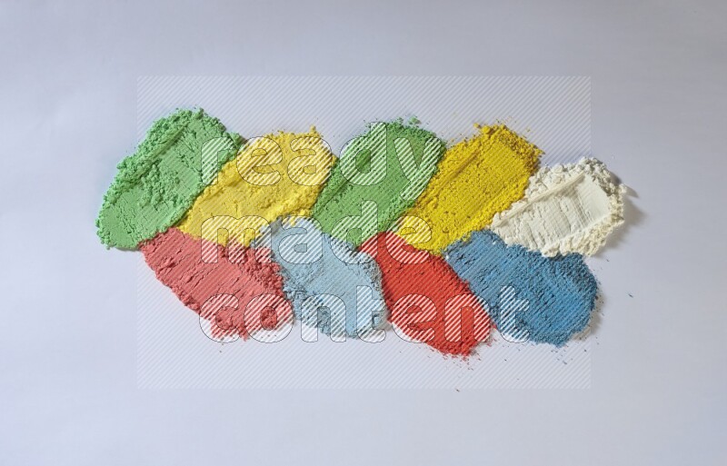 Multicolored powder smears on white background