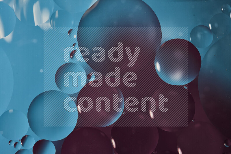 Close-ups of abstract oil bubbles on water surface in shades of blue and purple