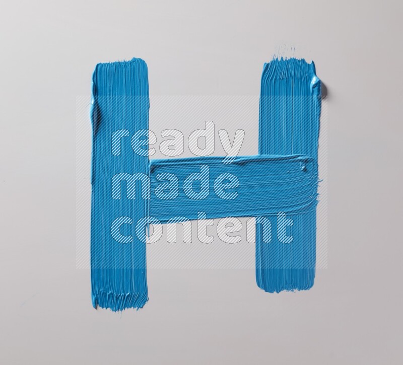 Multi blue straight brush strokes in different shapes on a white background