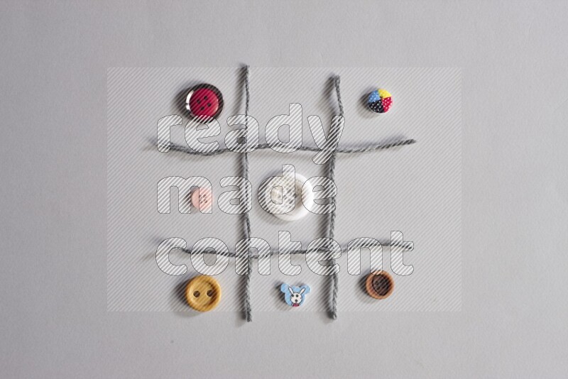 Multicolored buttons placed on grey background