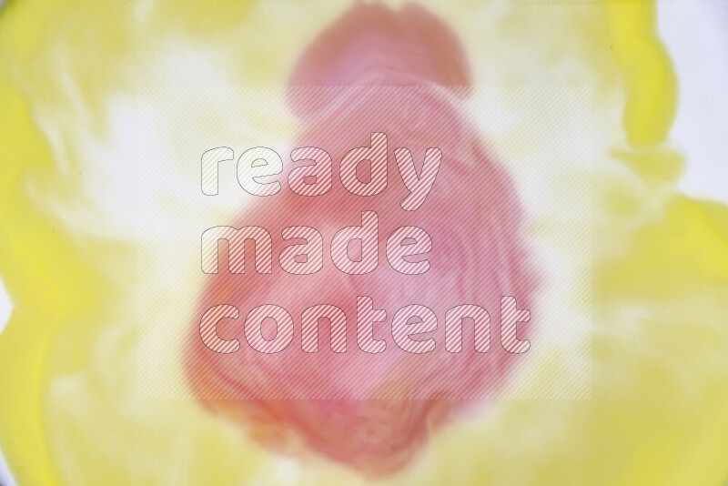 A close-up of abstract swirling patterns in yellow, red and white