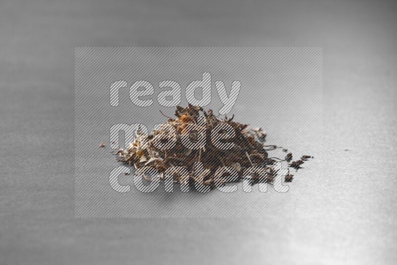 Dried basil on a black flooring