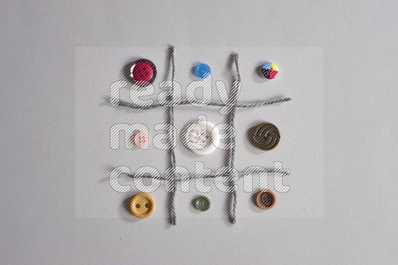 Multicolored buttons placed on grey background