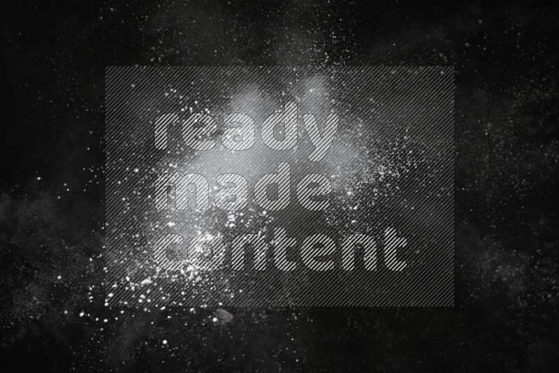White powder explosion on black background