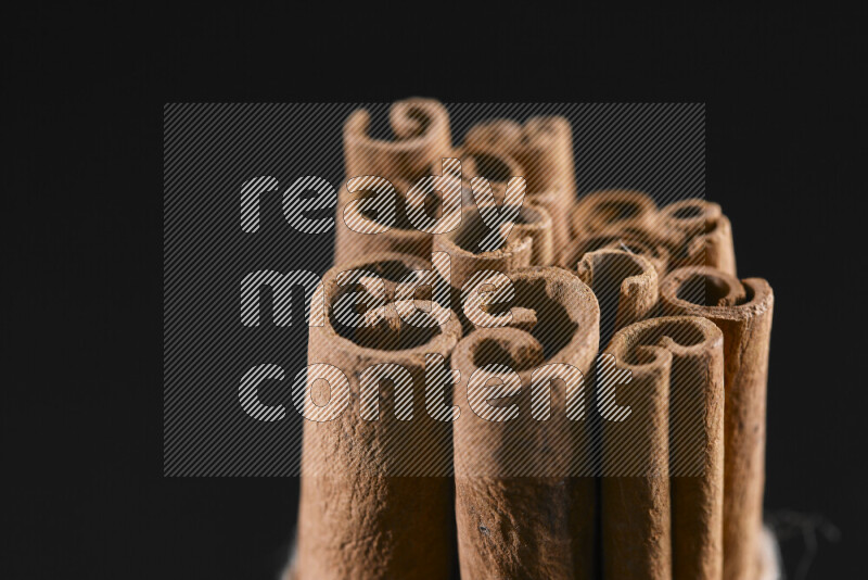 Cinnamon sticks on black background