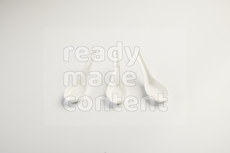 white ceramic soup spoon on white countertop