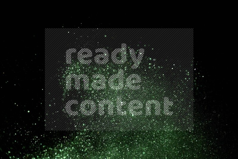 Green glitter powder isolated on black background