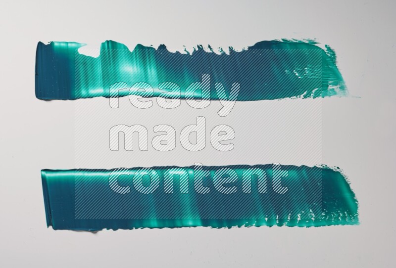 Turquoise painting knife strokes on white background