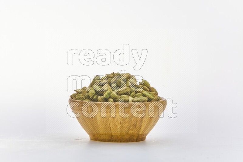 Cardamon in a container on white background