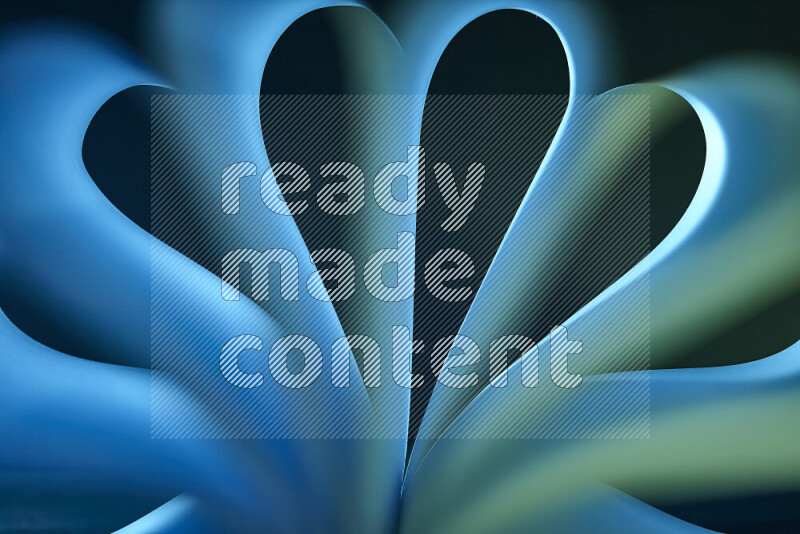 An abstract art piece displaying smooth curves in blue and green gradients created by colored light