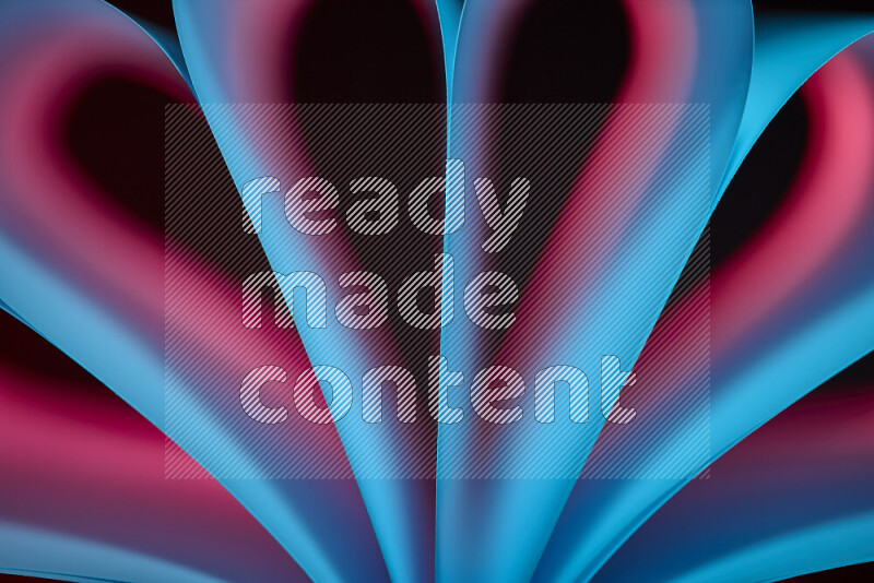 An abstract art piece displaying smooth curves in blue and red gradients created by colored light