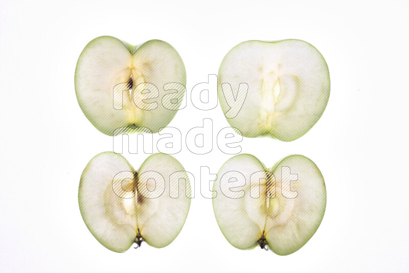 Apple slices on illuminated white background