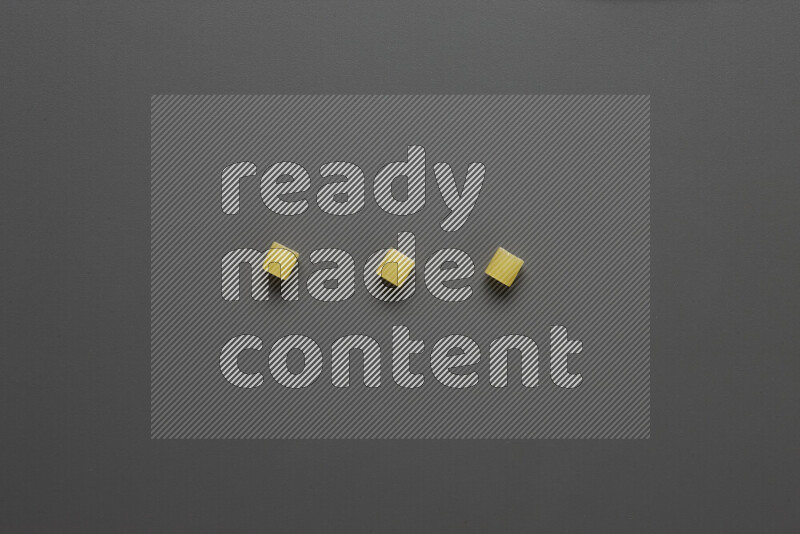 Small rings pasta on grey background