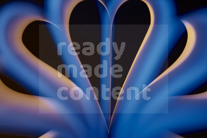 فن تجريدي يعرض منحنيات وتدرجات اللون الأصفر والأزرق مكونه بضوء ملون