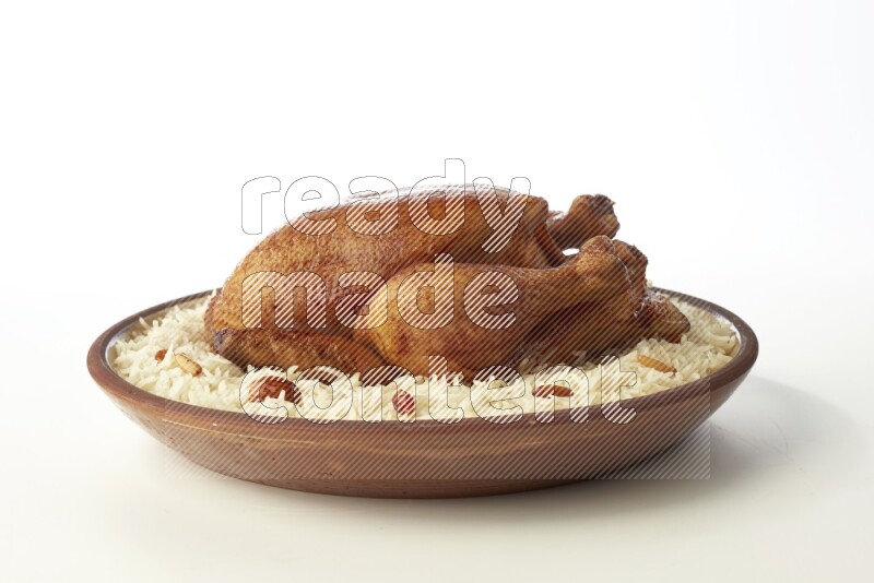 white  basmati Rice with  whole roasted chicken    on a pottery plate  direct  on white background