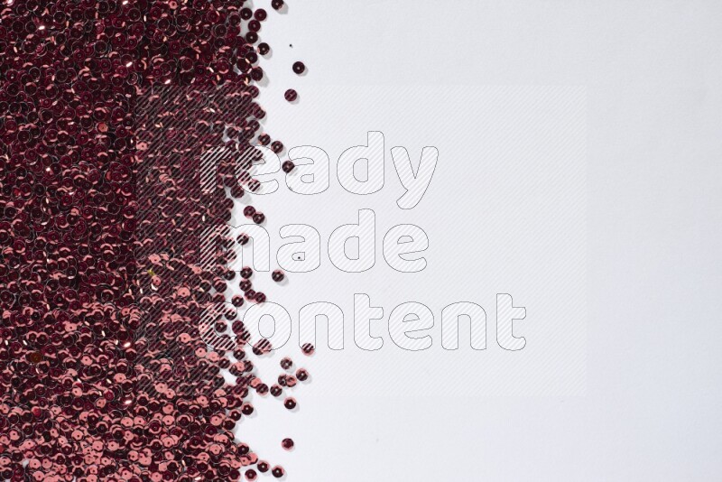 Multicolored flat sequins on grey background