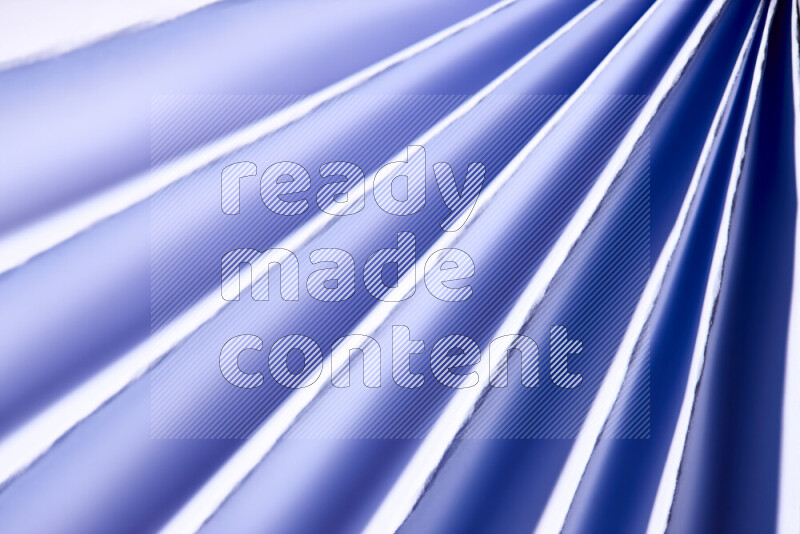 An image presenting an abstract paper pattern of lines in blue and white tones