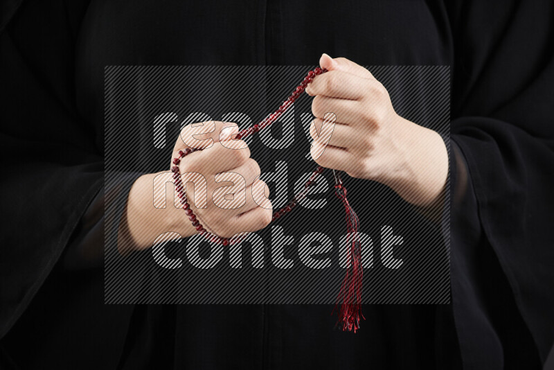 Woman hands holding praying beads (sebha) in different positions
