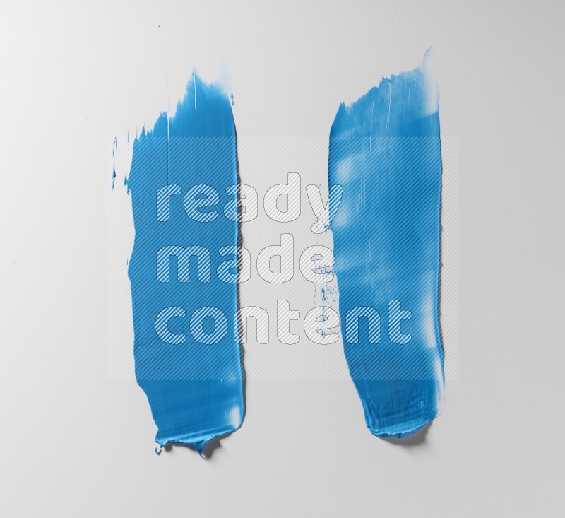 Blue painting knife strokes on white background
