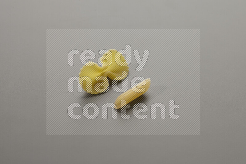 Fiocchi pasta with other types of pasta on grey background