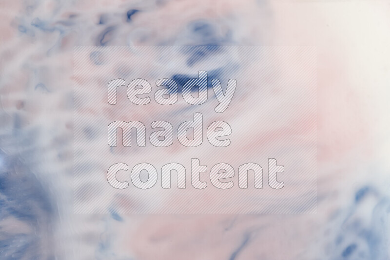 A close-up of abstract swirling patterns in blue, red and white