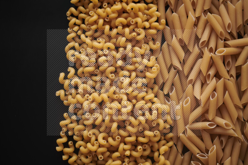 Different pasta types on black background