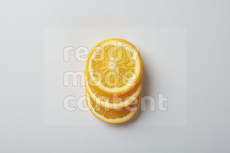 Three orange slices on a white background