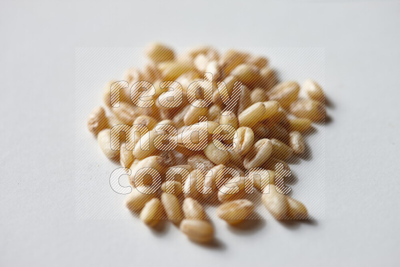 Hulled wheat on white background