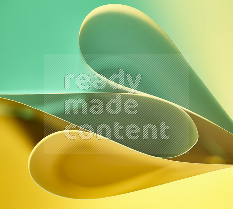 An abstract art of paper folded into smooth curves in green and yellow gradients