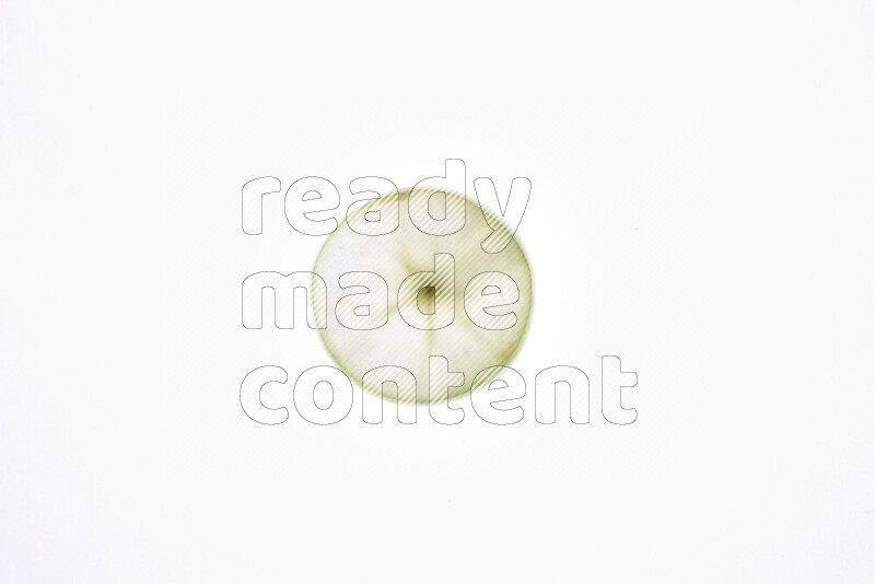 Apple slices on illuminated white background