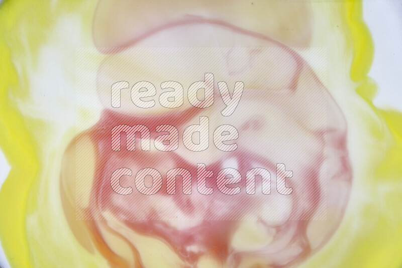 A close-up of abstract swirling patterns in yellow, red and white