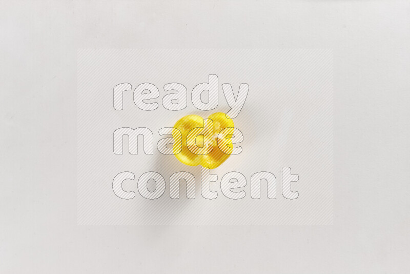 Yellow bell pepper slices on white background