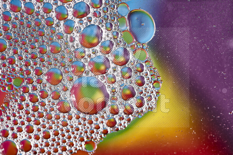 Close-ups of abstract soap bubbles and water droplets on multicolored background