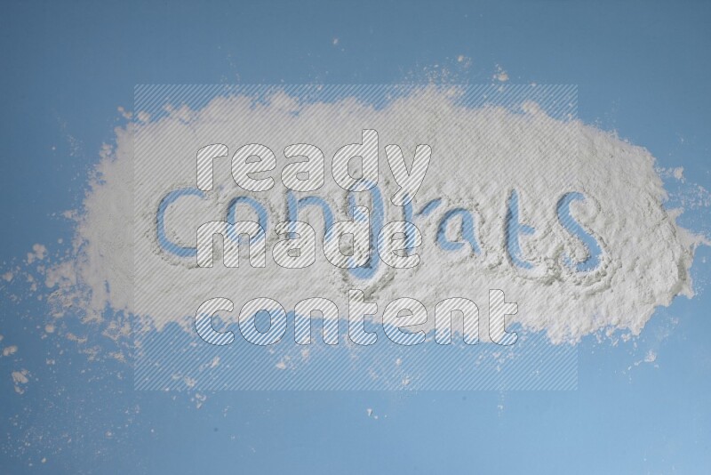 A word written with white powder on blue background