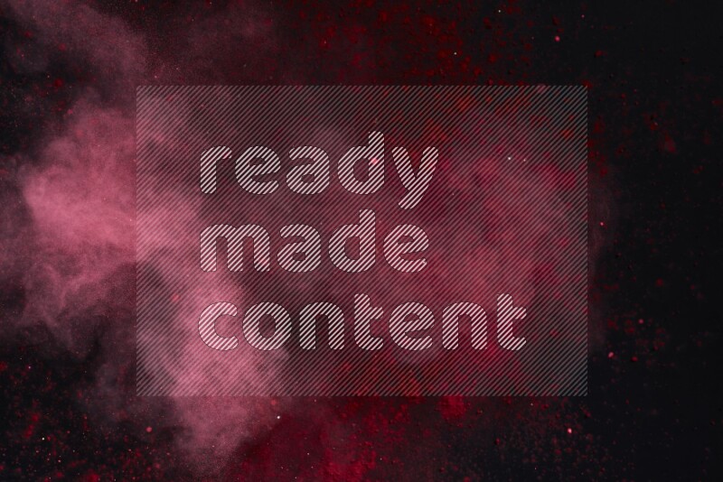 Red powder explosion on black background