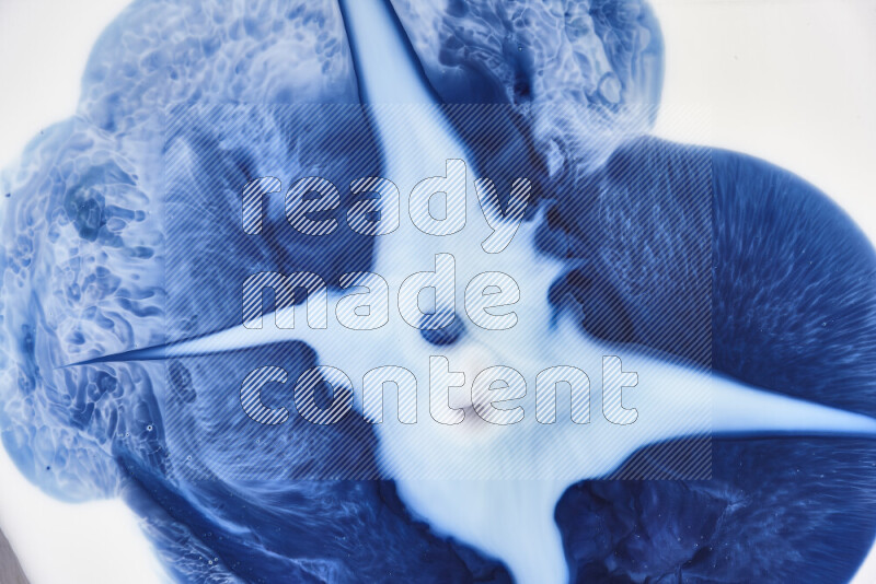 A close-up of abstract swirling patterns in blue and white