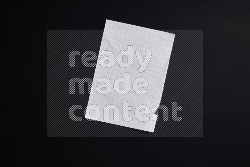 Notebook sheet on black background