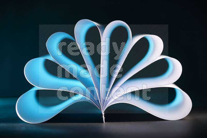 An abstract art piece displaying smooth curves in blue and white gradients created by colored light