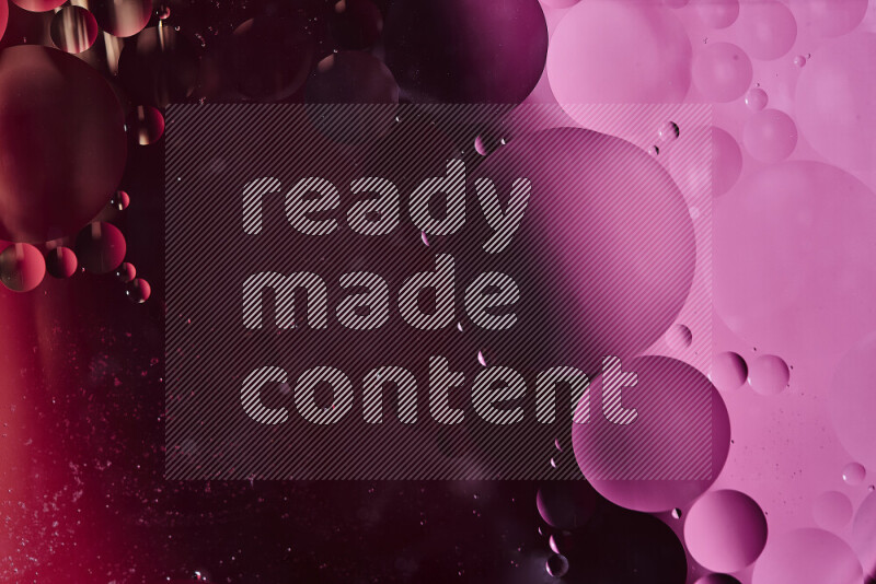 Close-ups of abstract oil bubbles on water surface in shades of red and pink