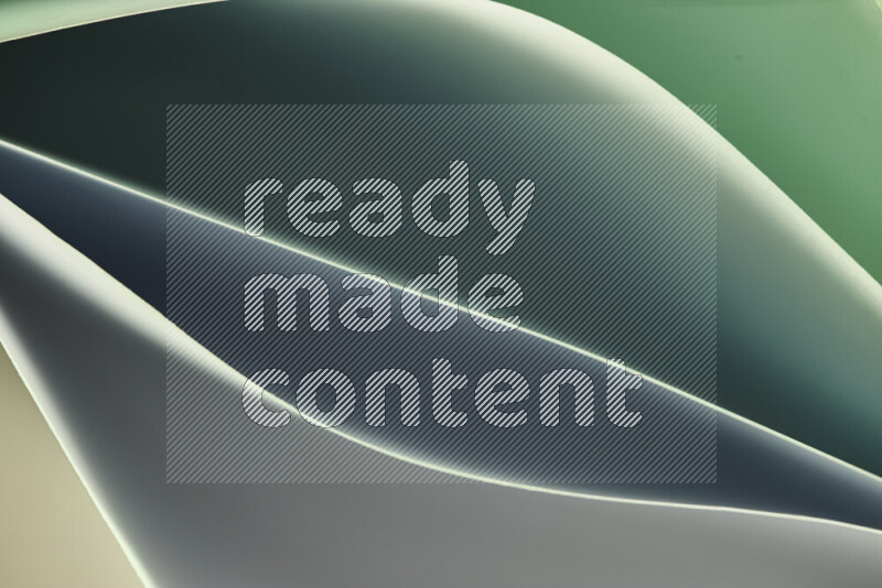 This image showcases an abstract paper art composition with paper curves in green gradients created by colored light