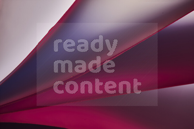 فن تجريدي يعرض منحنيات مع تدرجات الألوان الدافئة والباردة مكونه بضوء ملون