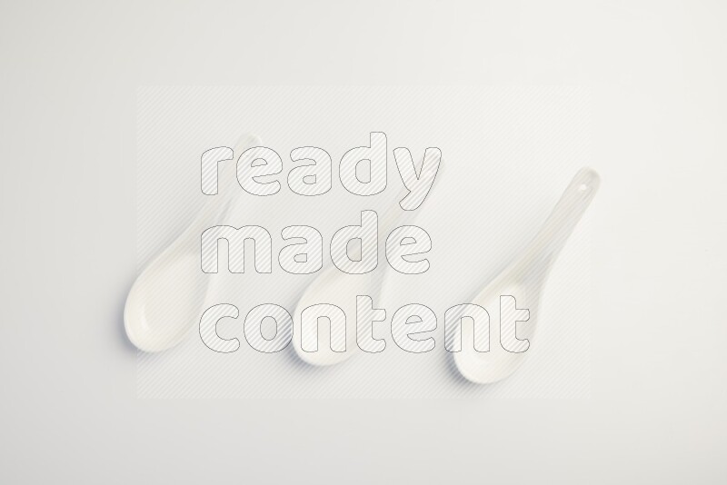 white ceramic soup spoon on white countertop