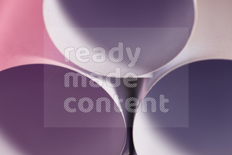 The image shows an abstract paper art with circular shapes in varying shades of purple